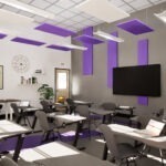 Interior of Christian Brothers Academy classroom with gray and black desks, gray walls, white ceiling, and violet panels.
